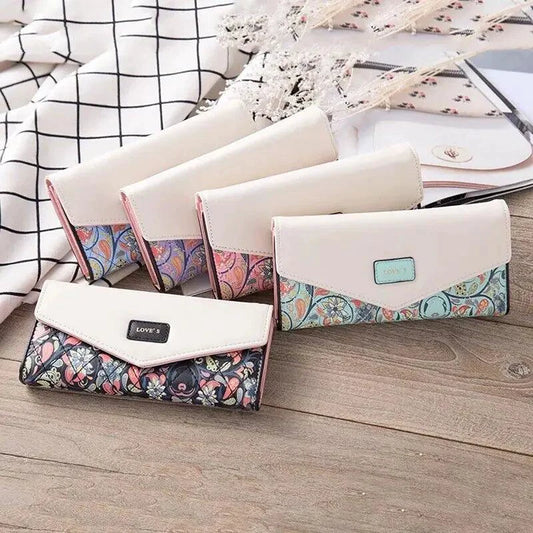 Mandotos women's leather clutch wallet with card holder, featuring a sleek design and multiple card slots for everyday use.