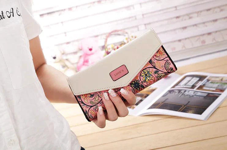 Mandotos women's leather clutch wallet and card holder with multiple card slots, black sleek design, and elegant finish.