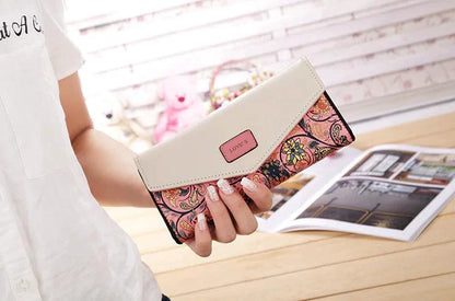 Mandotos women's leather clutch wallet and card holder with multiple card slots, black sleek design, and elegant finish.