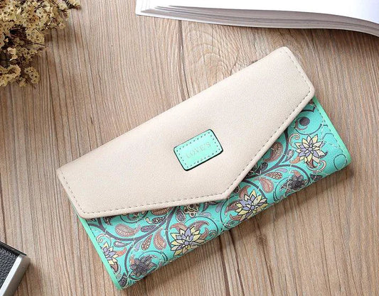 Mandotos women's leather clutch wallet and card holder with sleek design, compact size, and multiple card slots.