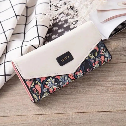 Mandotos women's leather clutch wallet with card holder, featuring a sleek design and compact size for everyday use.