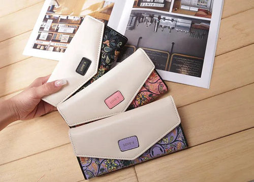 Mandotos chic women's leather clutch wallet and card holder with sleek design and compact storage for cards and cash.