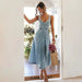 Mandotos CitySleek Denim Midi Dress displayed on a hanger, showcasing its stylish mid-length design and classic denim fabric.