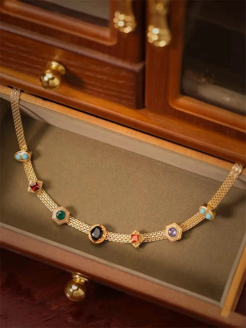 Vintage 14K gold choker necklace by MANDOTOS featuring a classic, elegant design with a smooth, polished finish.