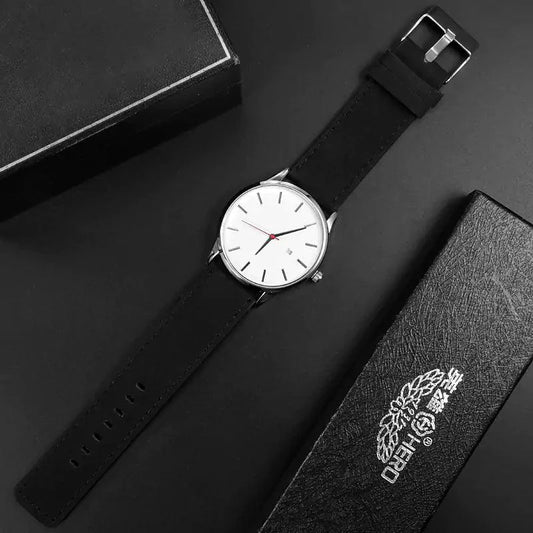 Mandotos classic leather timepiece with a black leather strap and round silver watch face showing time and minimalist design.