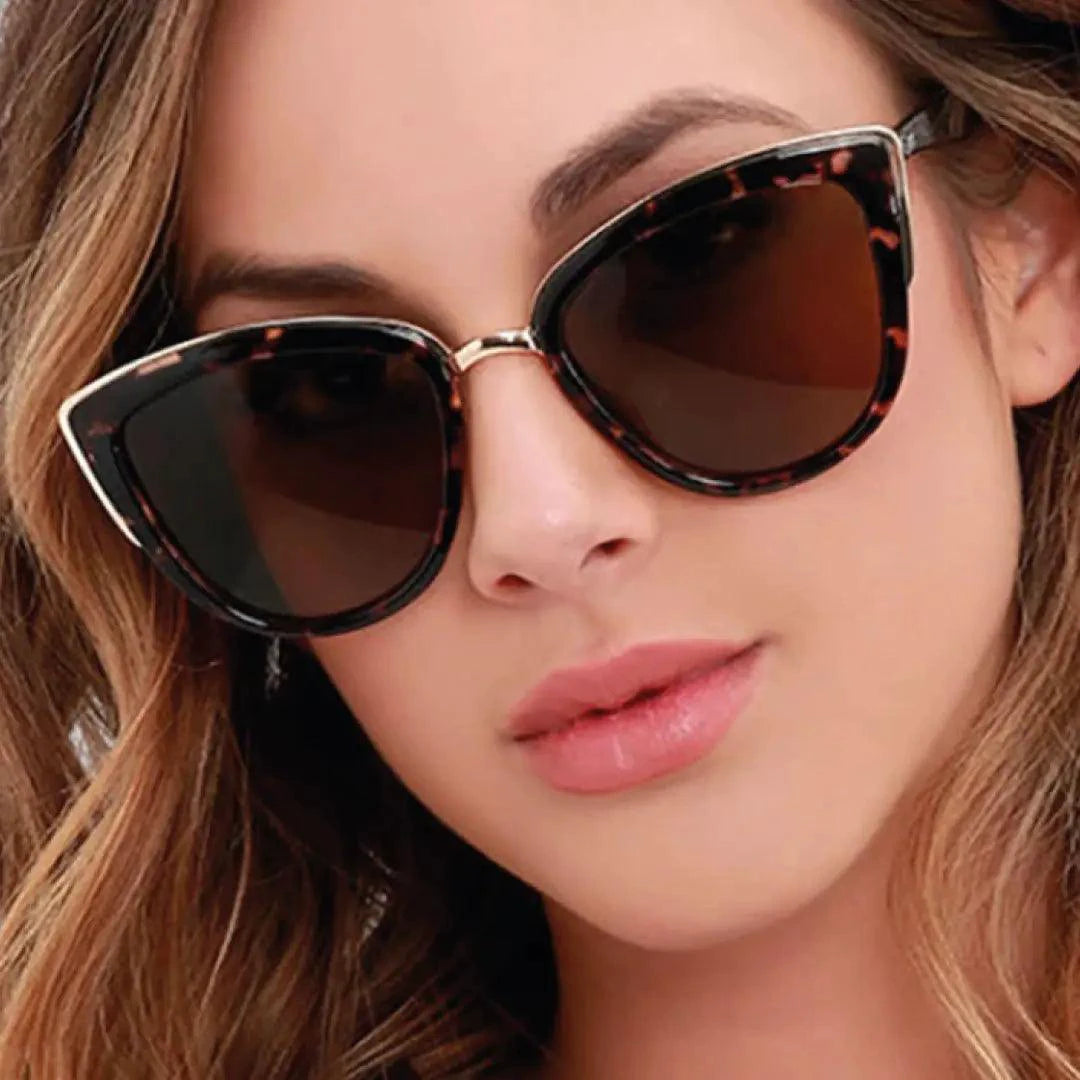 Mandotos Cleo Cat Eye Shades with black frames and dark tinted lenses, stylish sunglasses for women.