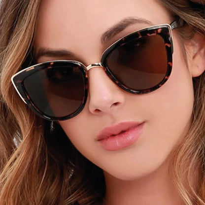 Mandotos Cleo Cat Eye Shades with black frames and dark tinted lenses, stylish sunglasses for women.