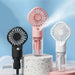 Mandotos compact hydrating mist fan with adjustable nozzle and ergonomic handle, delivering cooling mist for outdoor use