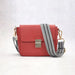Mandotos compact leather crossbody handbag in Cabernet color, featuring a sleek design and adjustable strap.