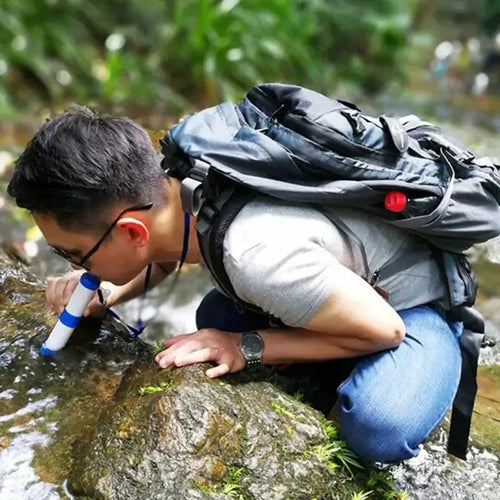 Mandotos Compact Travel Water Filter shown with attached spout and filter cartridge for portable water purification on the go.