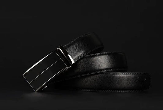 Contemporary MANDOTOS leather belt with sleek design and polished finish, shown in close-up view.