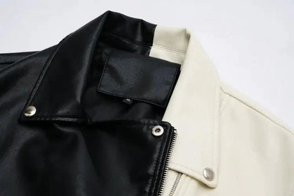 Mandotos contrast vegan leather jacket with stylish black and white color blocking, front zipper, and collar detail.