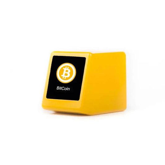 Mandotos Crypto Desk Tracker displaying a digital screen with cryptocurrency prices and market data on a sleek desk setup.