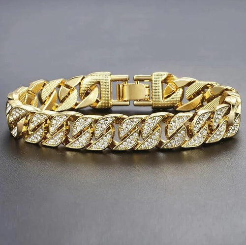 Gold Cuban curb bracelet by MANDOTOS featuring interlinked flat, rounded links for a stylish, bold jewelry accessory.