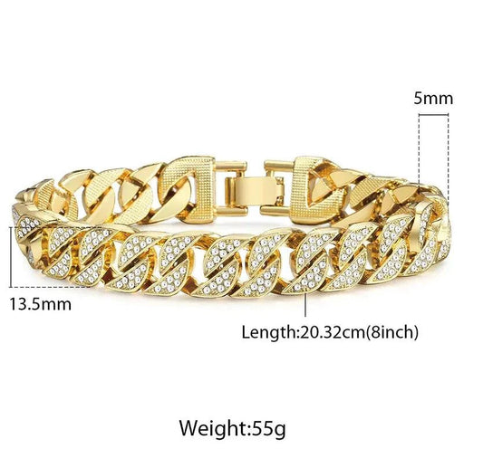 Close-up of a gold Cuban curb bracelet by MANDOTOS, showcasing its shiny, interlinked chain design.