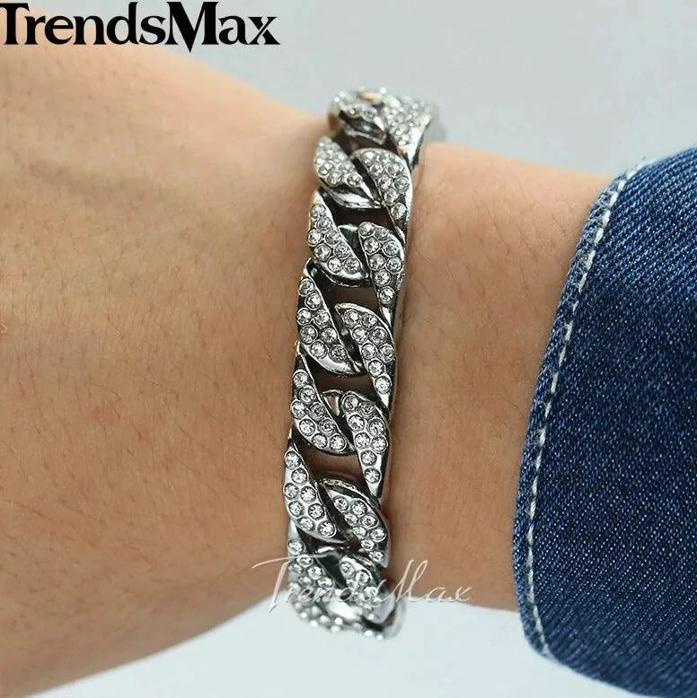 Gold Cuban curb bracelet by MANDOTOS featuring interlocking flat links on a sleek chain design.