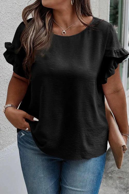 Mandotos Curvy Samantha Blouse displayed on a model, featuring a stylish, fitted design with vibrant colors and elegant details.