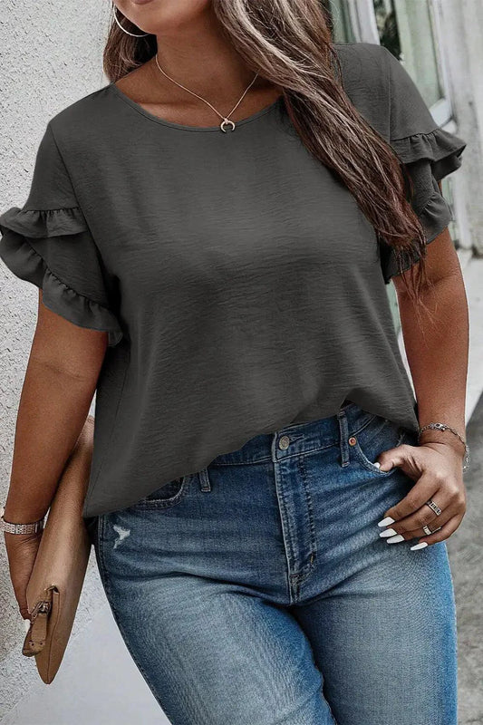Mandotos Curvy Samantha Blouse featuring a flowy fit, vibrant pattern, and stylish neckline, perfect for casual or dressy occasions.