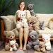 Mandotos 23-45cm plush teddy bear pillow with hugging roses design, soft stuffed animal doll, ideal for gifts on special occasions.