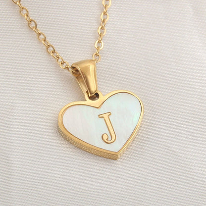 Mandotos white shell heart-shaped letter necklace with personalized 26-letter pendant, ideal for women’s Valentine's Day jewelry.