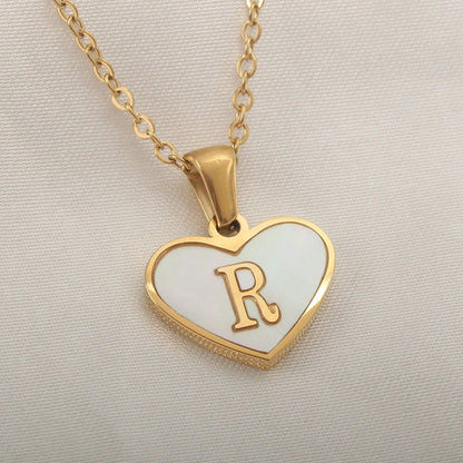 Mandotos 26-letter heart-shaped necklace with white shell accents, personalized clavicle chain jewelry for women, perfect for Valentine's Day.