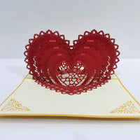 Mandotos 3D laser-cut engagement card with red heart and romantic silhouette, featuring intricate heart and love-themed design.