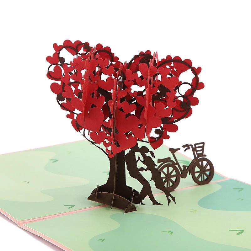 Mandotos 3D laser-cut engagement card with red heart and romantic silhouette, featuring intricate heart and love-themed design.