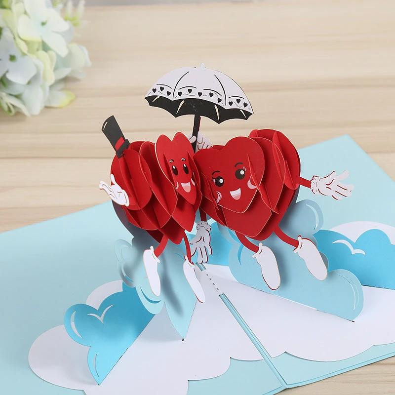 Mandotos 3D laser-cut engagement card featuring a red heart and romantic silhouette design.