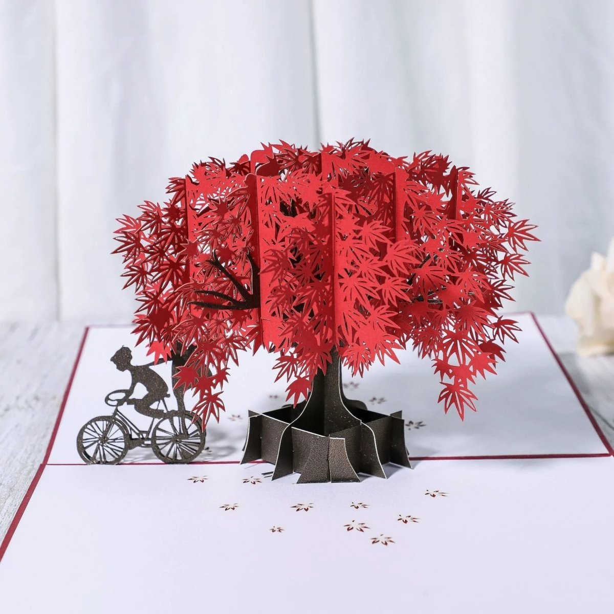 Mandotos 3D laser-cut engagement card featuring a red heart and romantic silhouette, with intricate design details.