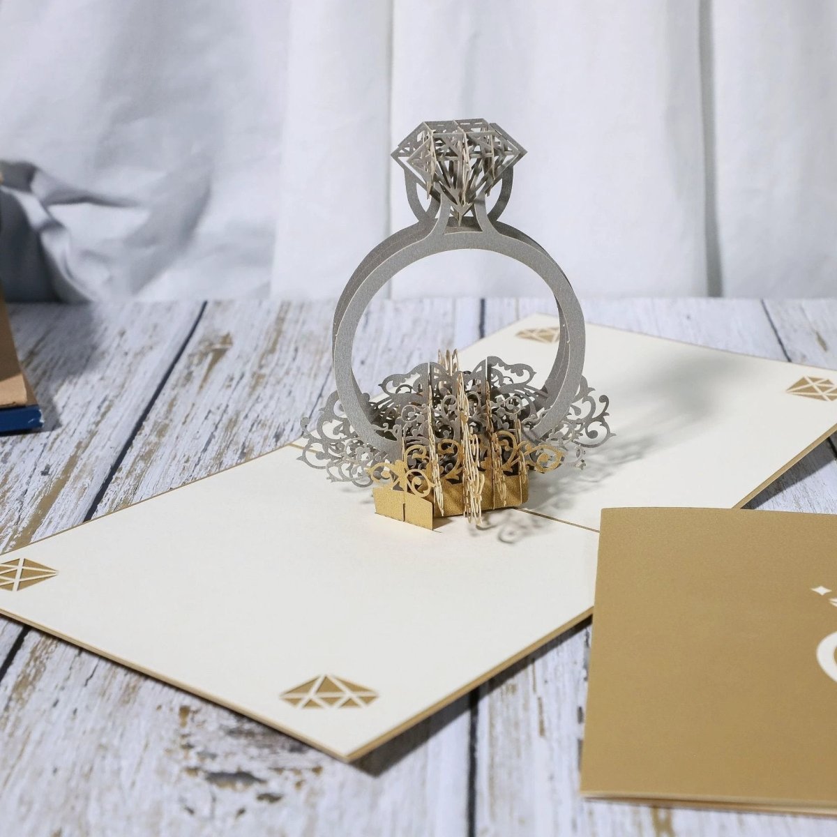 Mandotos 3D laser-cut engagement card with red heart and romantic silhouette, featuring intricate romantic design.