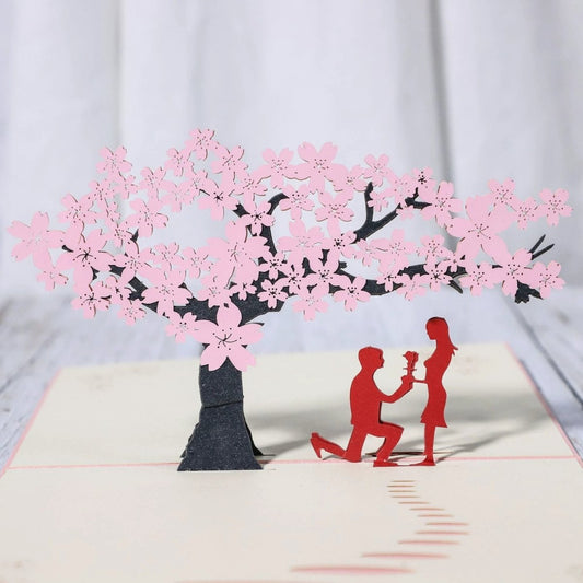 Mandotos 3D laser-cut engagement card featuring a red heart and romantic silhouette, with intricate laser detailing and elegant design.