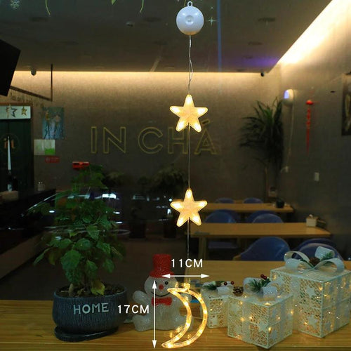 Mandotos Christmas 3-pack LED star hanging lights with suction cups for home decor, battery-powered, decorative lighting for festive spaces.