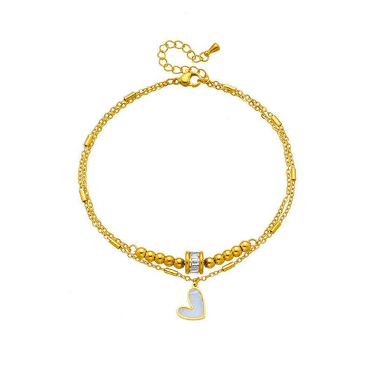 Mandotos boho love heart ankle chain with double layers, charm tassels, and leg chain design for women’s party jewelry accessories.
