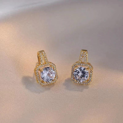 Mandotos fashion jewelry set with zircon gem necklace, matching earrings, and ring, featuring sparkling stones and elegant design.