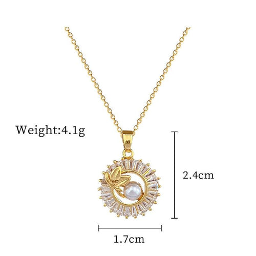 Mandotos jewelry suite with a square full diamond personalized round ring, leaves necklace, and matching earrings.