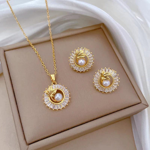 Mandotos fashion jewelry set with square diamond ring, personalized round ring, leaves necklace, and matching earrings.