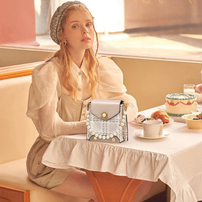 Mandotos women's crossbody bag with pearl chain, cute princess wallet design, classic shoulder style, perfect for summer.