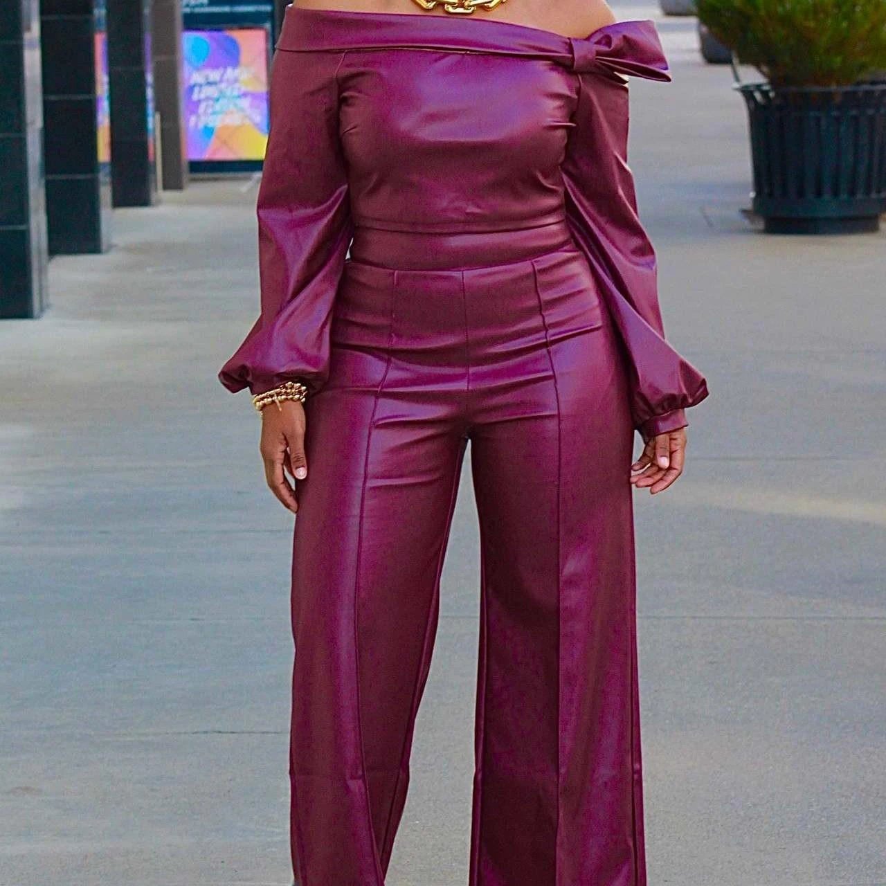 Mandotos Glamourista women's trendy leather suit showcasing chic, confident style with tailored design and sleek black leather.