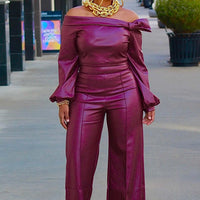 Women’s trendy leather suit by MANDOTOS, styled for a chic and confident look, featuring a sleek jacket and matching pants.