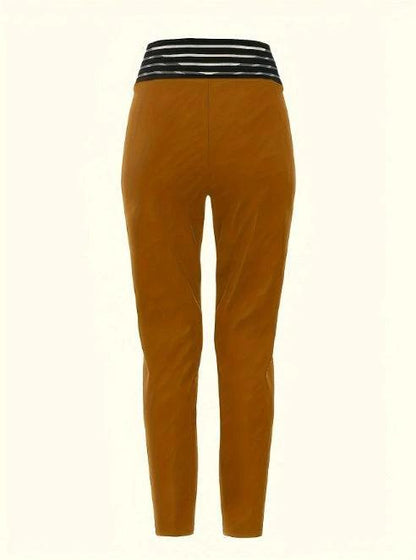 Mandotos women's solid color high waist casual pants with hollow design, slim fit and fashionable style, perfect for everyday wear.