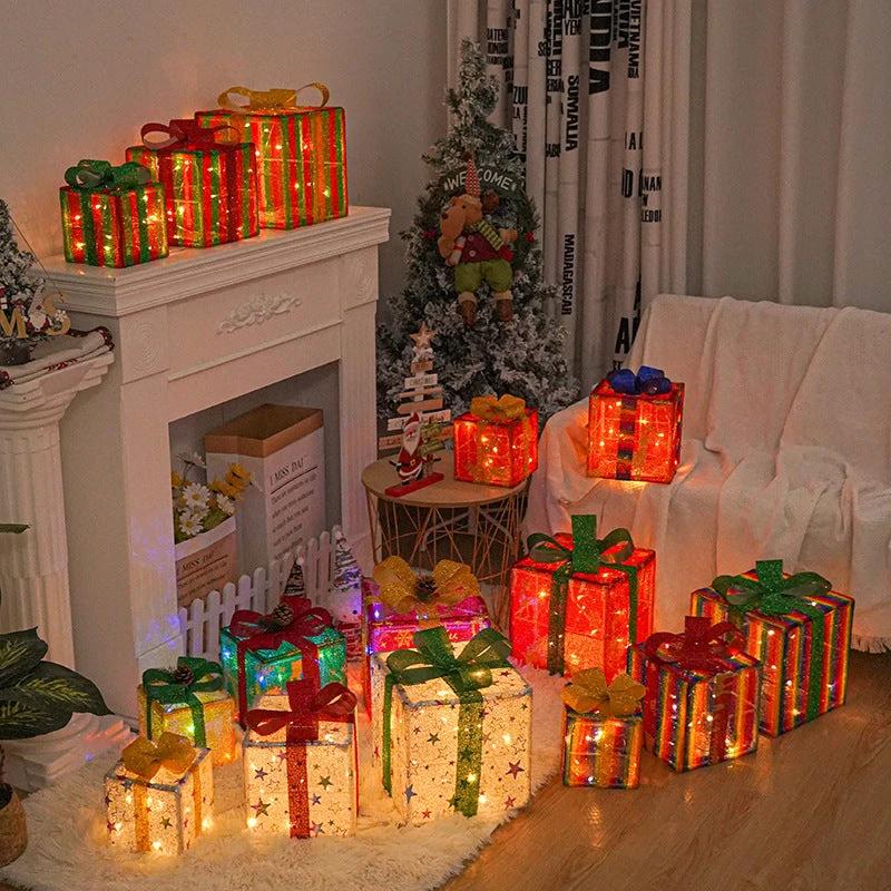 Lighted Christmas gift box decoration with bow by MANDOTOS, outdoor luminous holiday decor for festive outdoor display.
