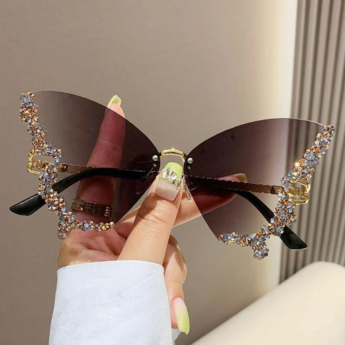 Mandotos luxury diamond butterfly sunglasses for women, Y2K vintage rimless oversized eyewear with stylish shades.