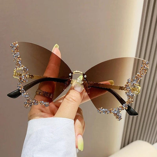 Mandotos luxury diamond butterfly sunglasses for women, Y2K vintage rimless oversized eyewear with stylish shades.