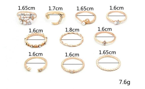 Mandotos Bohemian star, moon, pearl, and leaf ring set with gold finish, featuring 10 stackable rings on a white background.
