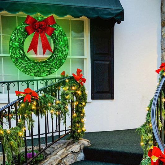 Mandotos Christmas wreath with luminous LED lights, metal garland, and bowknot for front door decoration.