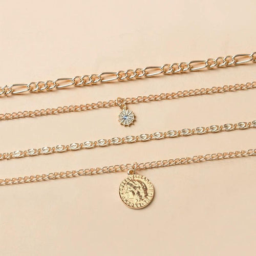 Mandotos chunky gold layered necklace with coin pendant and sun charm for women, featuring bold and stylish jewelry design.