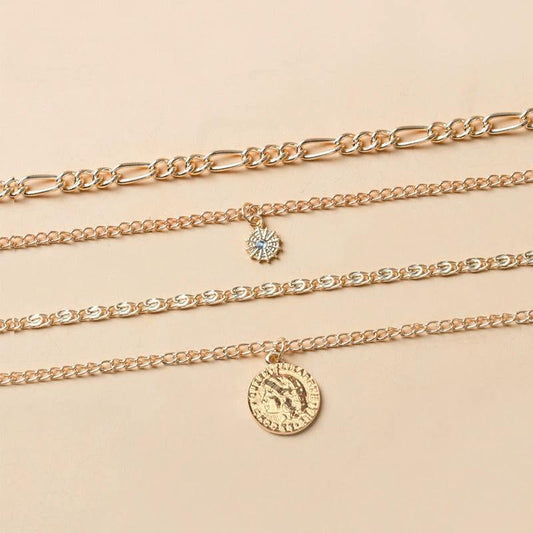 Mandotos chunky gold layered necklace with coin pendant and sun charm for women, featuring bold and stylish jewelry design.