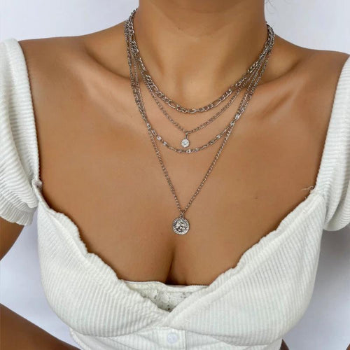Mandotos chunky gold layered necklace with coin pendant and sun charm for women, featuring bold, stylish jewelry design.