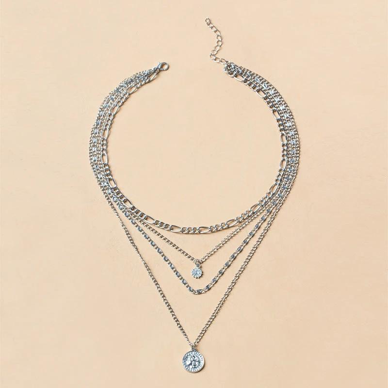 Mandotos chunky gold layered necklace featuring a coin pendant and sun charm for women, stylish jewelry accessory.