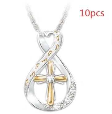 Mandotos cross footprint diamond pendant necklace in two-tone gold with intricate design and sparkling diamonds.
